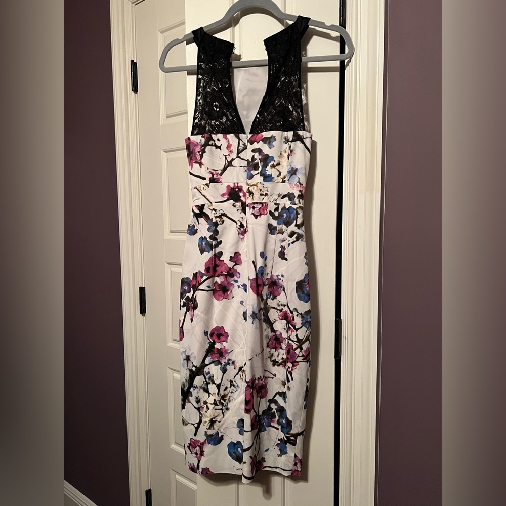 Floral, ruched, knee length dress.
